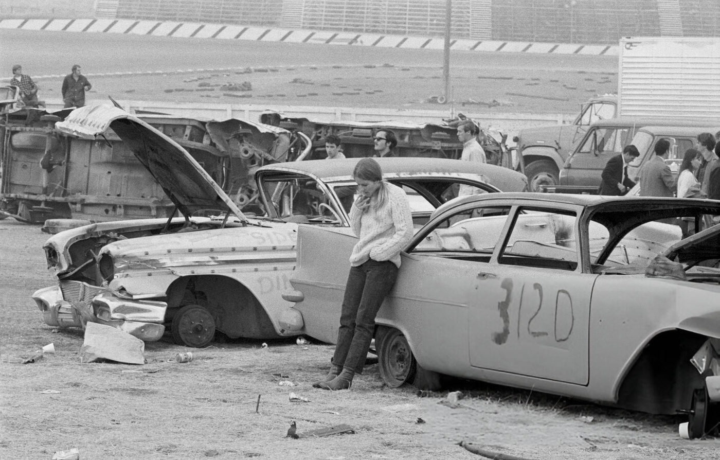 A Woman Smoking Near Derelict Cars At The Altamont Free Concert, 1969.
