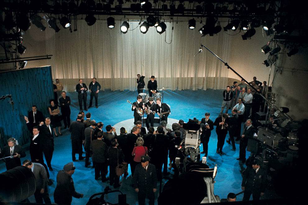 The Beatles Are Surrounded By Photographers On Stage At Cbs' Studio 50 Before Their Live Television Appearance On The Ed Sullivan Show In New York City, February 9, 1964.