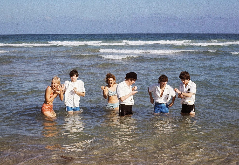 The Beatles Wade In The Surf In Miami, Florida With Unidentified Women, 1964.