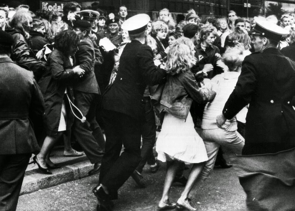 4,000 Beatles Fans Gathered In The Streets Around The Royal Hotel In Copenhagen, Denmark, Several Hours Before The Beatles Arrived, June 4, 1964; Danish Police Try To Hold Back The Fans From Rushing The Hotel.
