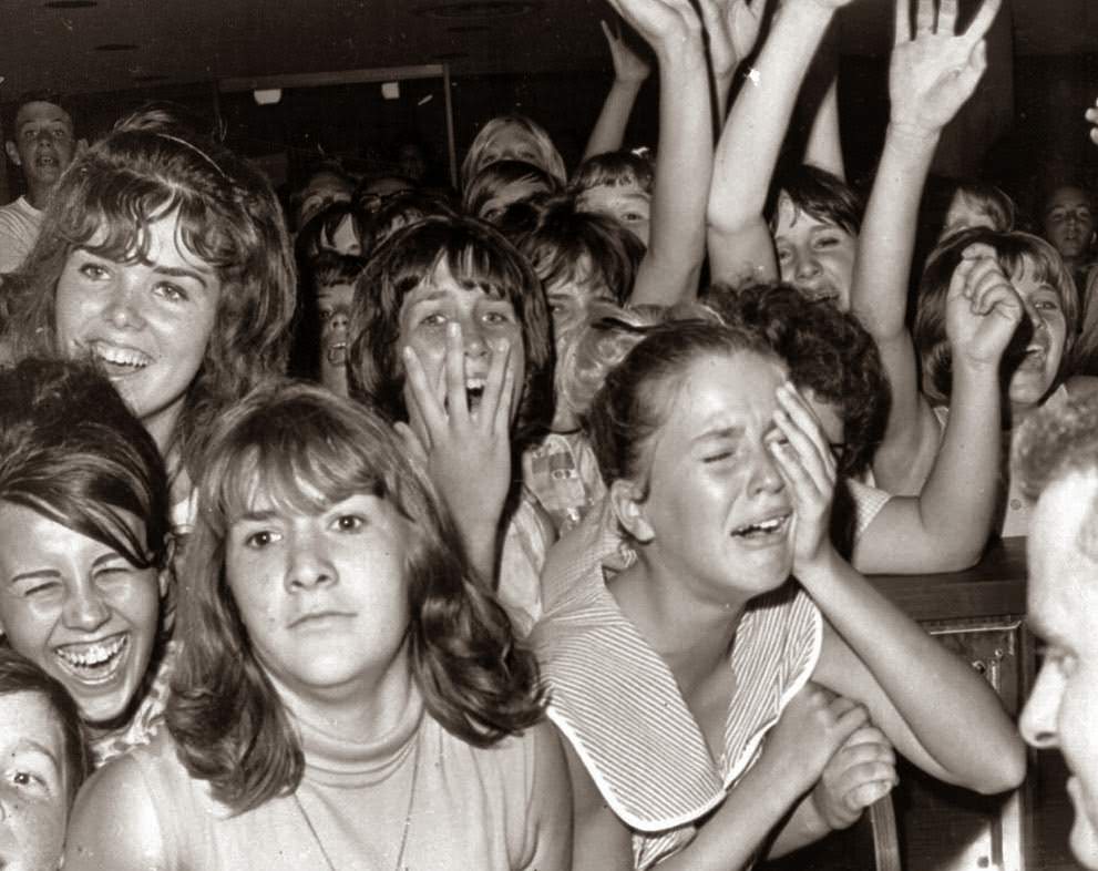 The Sight Of The Beatles From A Distance Caused This Reaction Among A Group Of Girls At The Los Angeles International Airport, August 18, 1964.