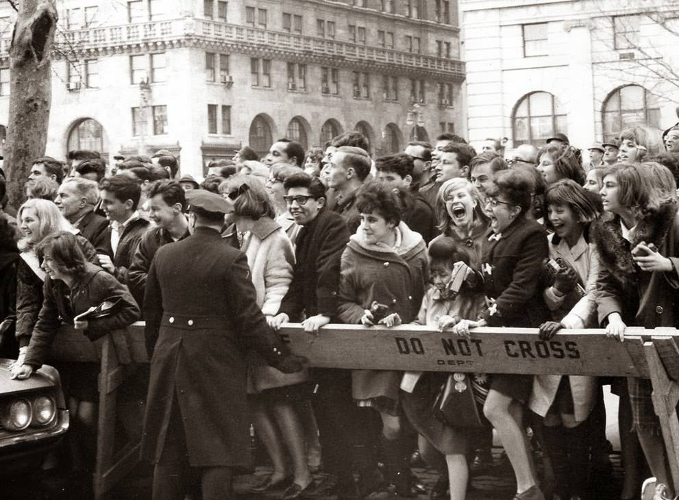 Beatles Fans Push Forward Hoping To Get A View Of The Band After Their Arrival For An American Tour In New York, February 7, 1964.