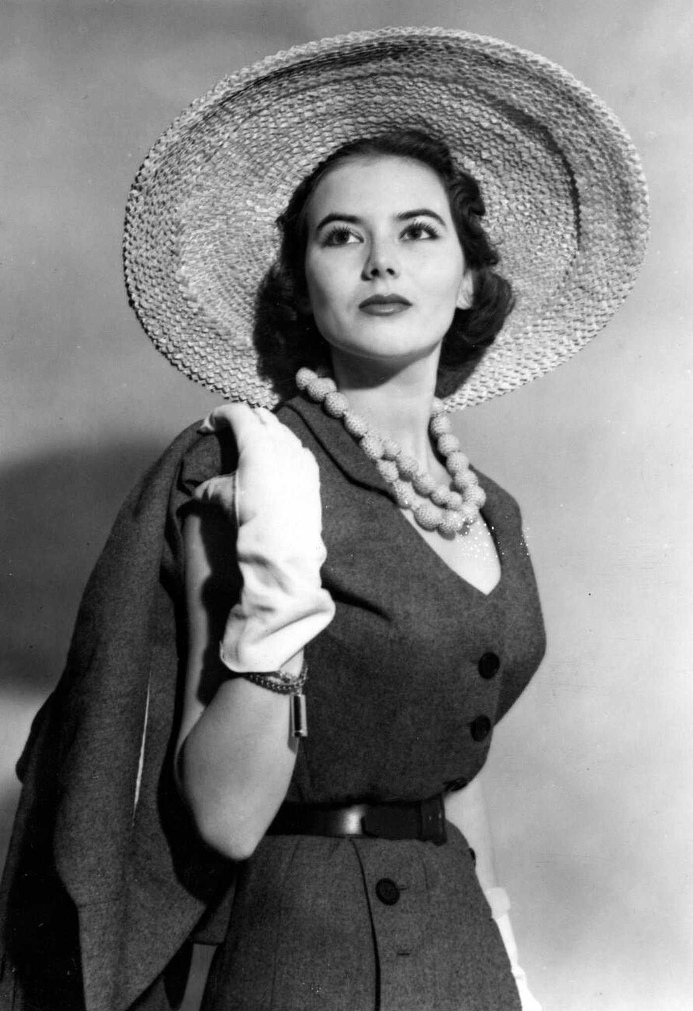 Sylvie, Said To Be The Most Photographed Model In Paris With The Smallest Waist (20&Amp;Quot;&Amp;Quot;), Models Christian Dior'S Paris Sport Grey Flannel Ensemble With Large Natural Straw Hat At The Savoy Hotel, 1950.