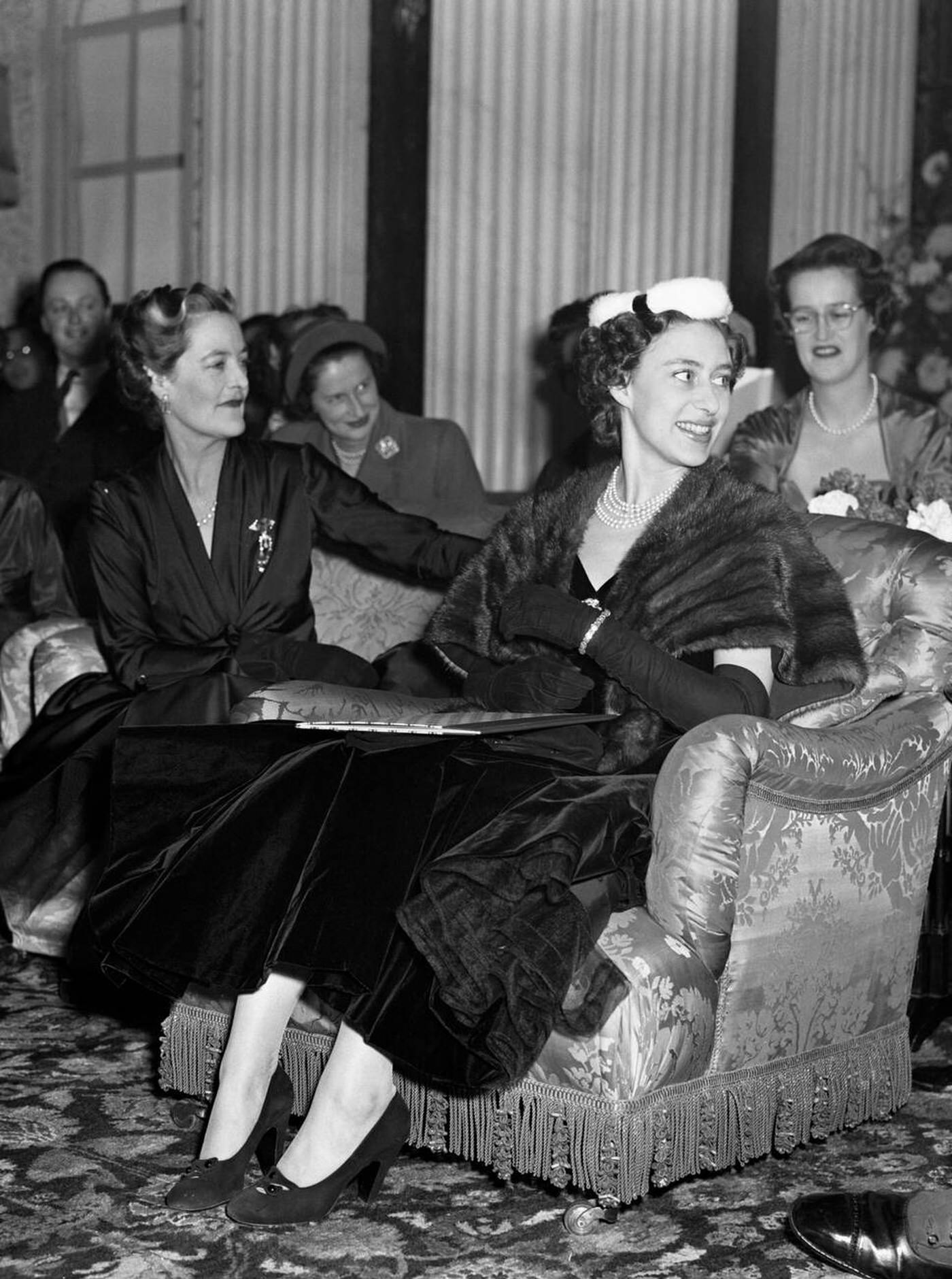 Princess Margaret, Seated Beside The Duchess Of Marlborough, Watches A Showing Of Christian Dior'S Paris Winter Collection Held In Blenheim Palace In Aid Of The British Red Cross Society, 1954.
