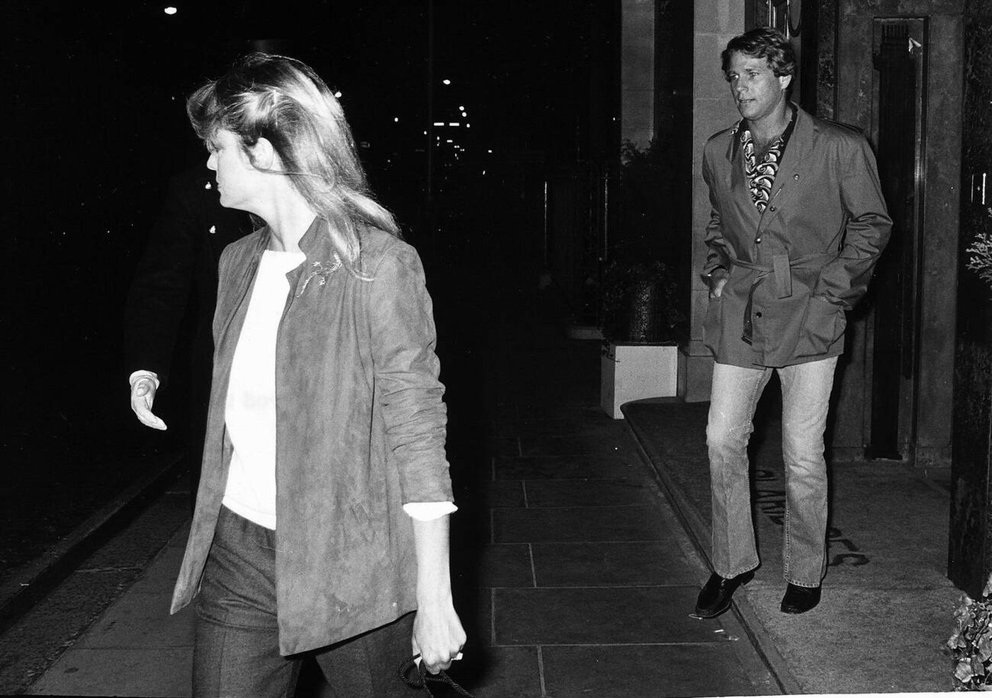 Farrah Fawcett And Ryan O'Neal Walking Out Of Claridges, 1980.