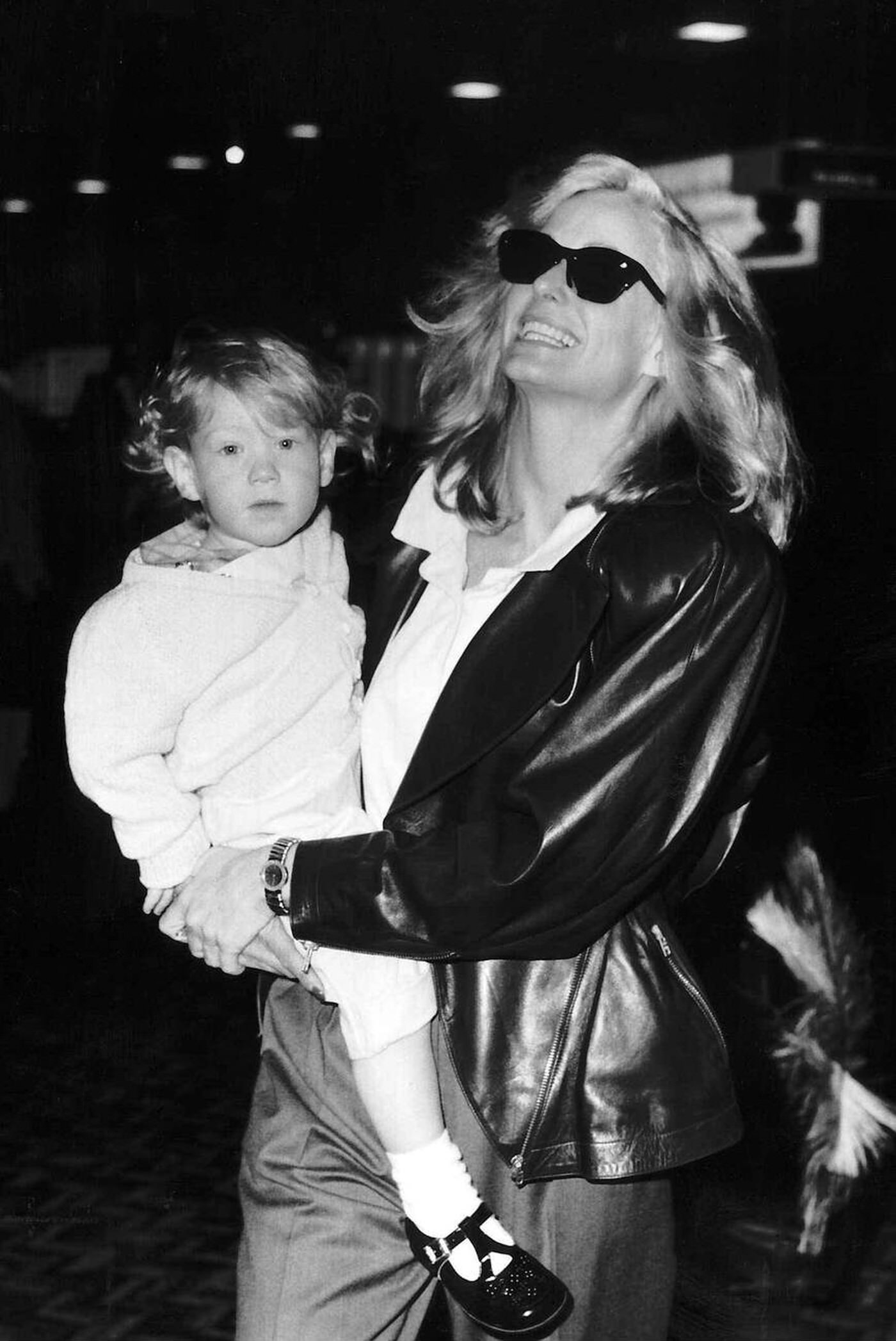 Farrah Fawcett With Her Son Redmond Leaving For Los Angeles, 1987.