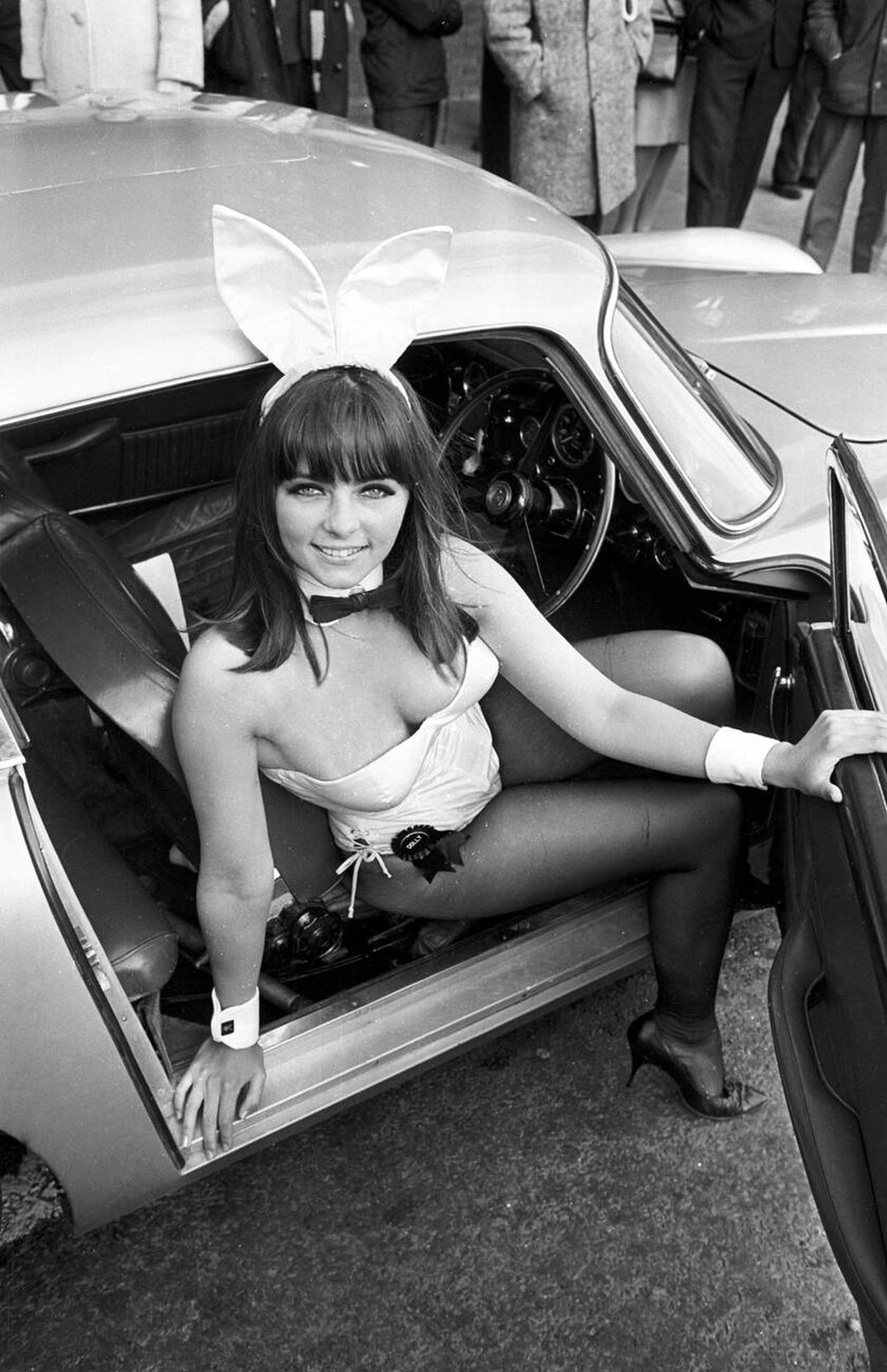 Dolly Read Takes A Seat In The Aston Martin Db 5 Car Used In A James Bond Film; Dolly, Together With Other British Bunnies, Flew In From The Us Where She Had Been Training, And Will Start Training Another 94 Bunnies For Europe'S First Playboy Club Opening In London In June, 1966.