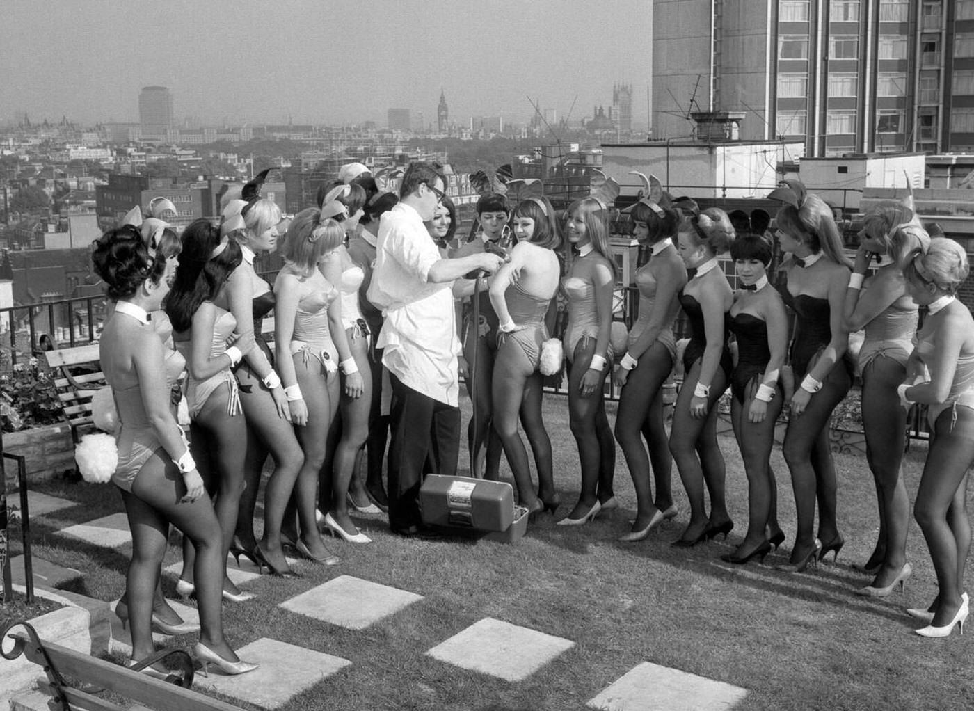 The Bunny Girls Line Up For Mike Steel Who Vaccinated Them Against Influenza At The Playboy Club In Park Lane, London, 1966.