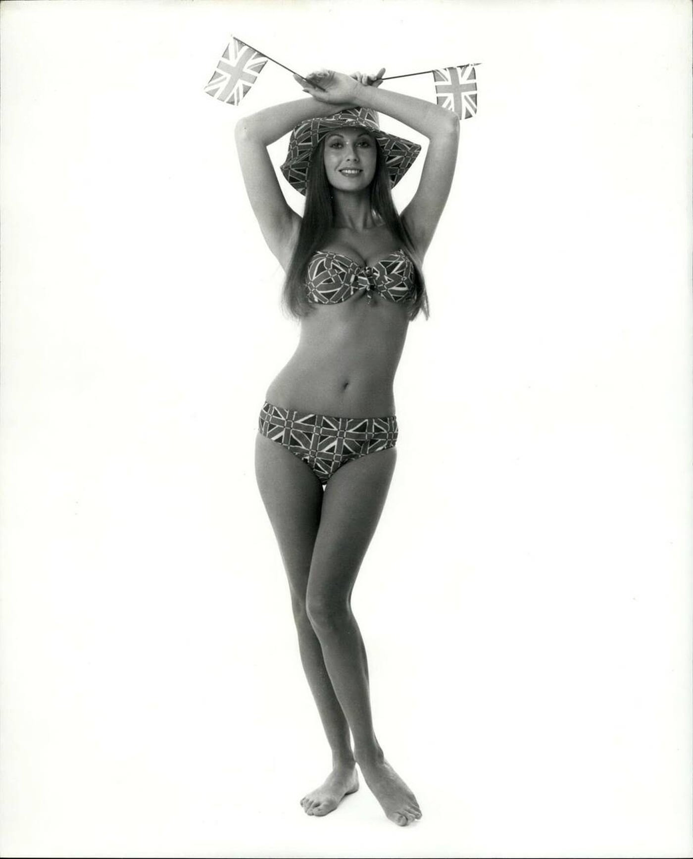 Marilyn Cole, Playboy Playmate Of The Year, Shows Off The Union Jack, 1973.