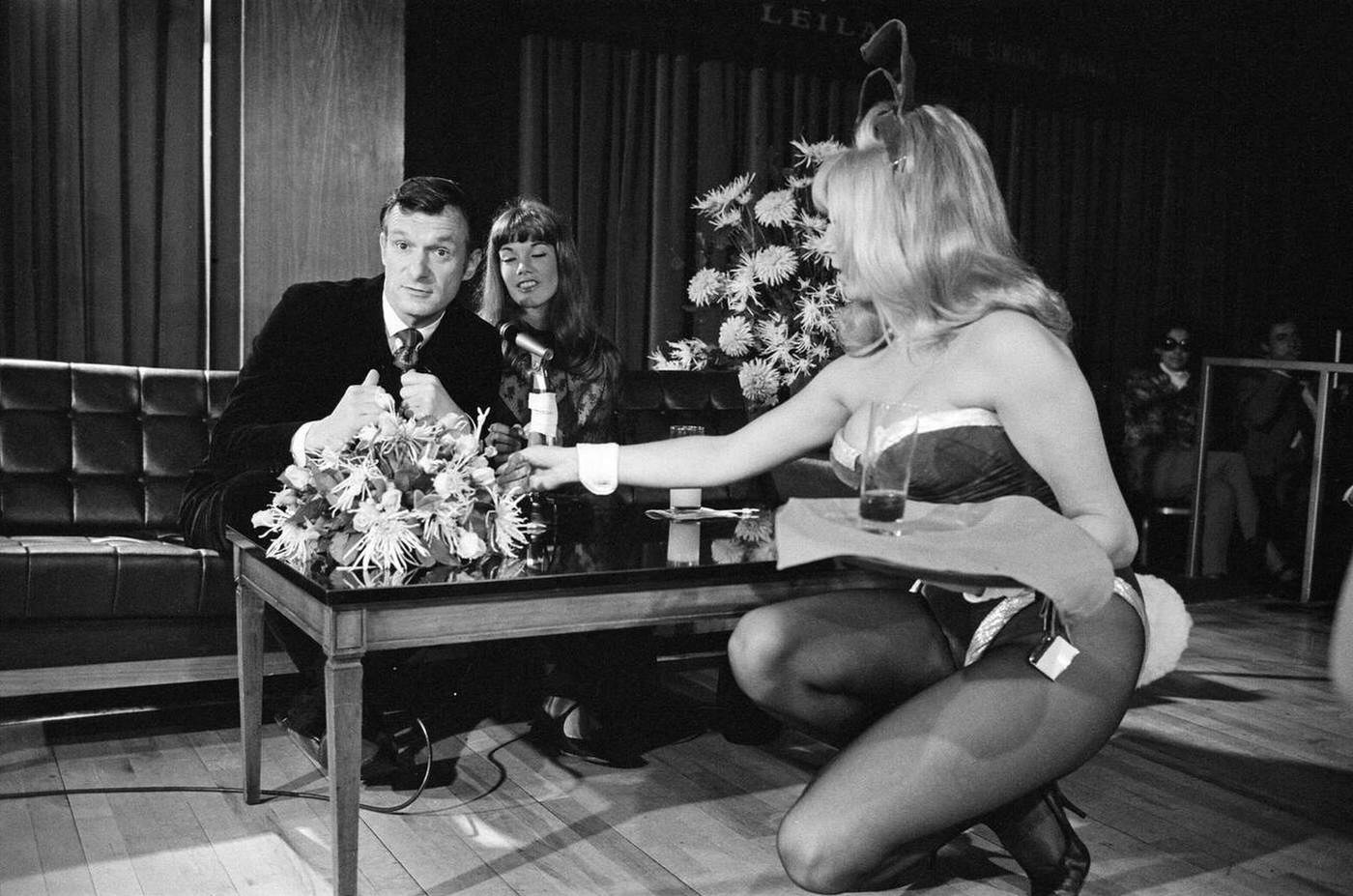 Hugh Hefner And Barbara Benton Are Given A Drink By Bunny Girl Andree Wittenberg At A Press Conference At The London Playboy Club To Announce The Formation Of The Playboy Film Production Company, 1969.