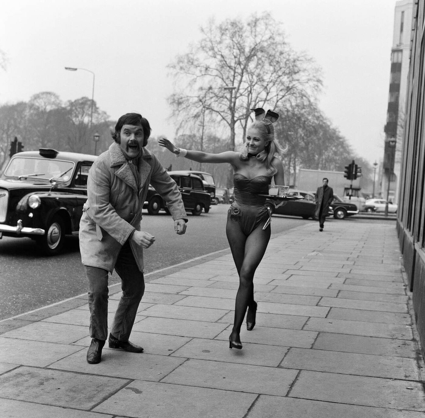 Kenneth Cope Being Chased Down Park Lane By Jennifer Watts While Shooting A Film Outside The Playboy Club, 1971.