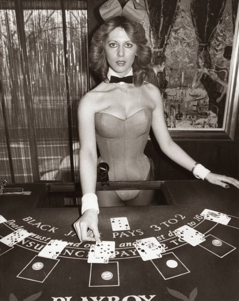 Croupier And Bunny Girl Corrina Dealing Cards At The Hefner-Playboy Park Lane Club In London, 1978.