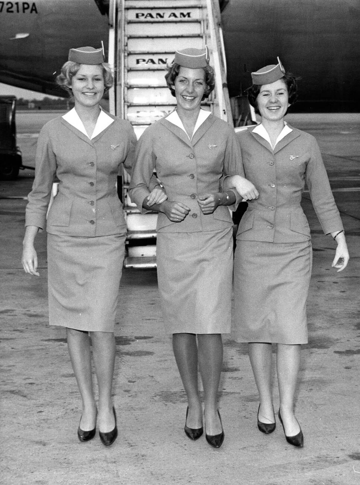 Three Sisters Who Work For The Same Airline , A Pan American Stewardess And Two Receptionists, Meet At London Airport, 1963.