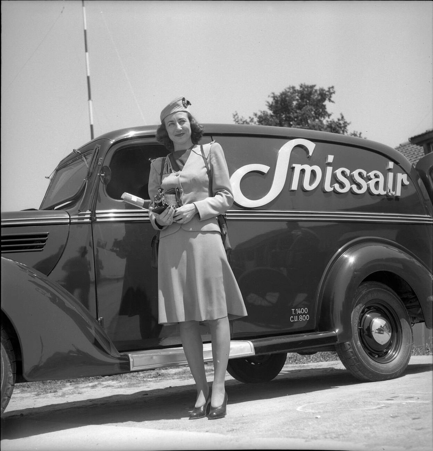 Air Hostess Posing In Front Of A Swissair Car, Geneva, 1946.