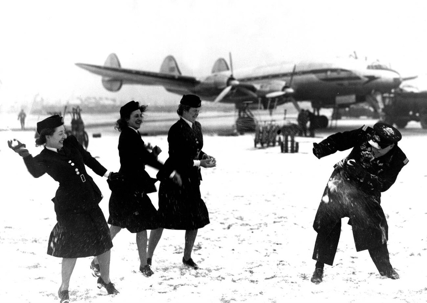 Boac Air Hostesses And Ground Staff Carry Out A Mass Snowball Attack On The Station Deputy Superintendent During A Lunch Hour Battle, 1947.