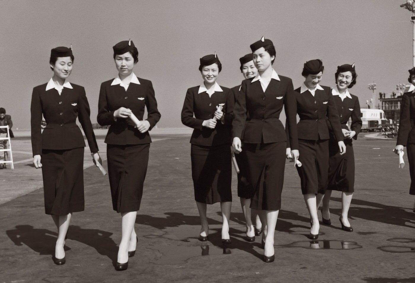 Japan Airlines Stewardesses Dressed In Navy Suits, Designed By Mohei Ito, 1958.