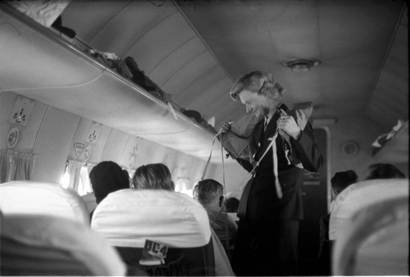 A Flight Attendant Demonstrates Life Jackets And Other Security Procedures, Sas Flyrute Copenhagen / New York, 1948.