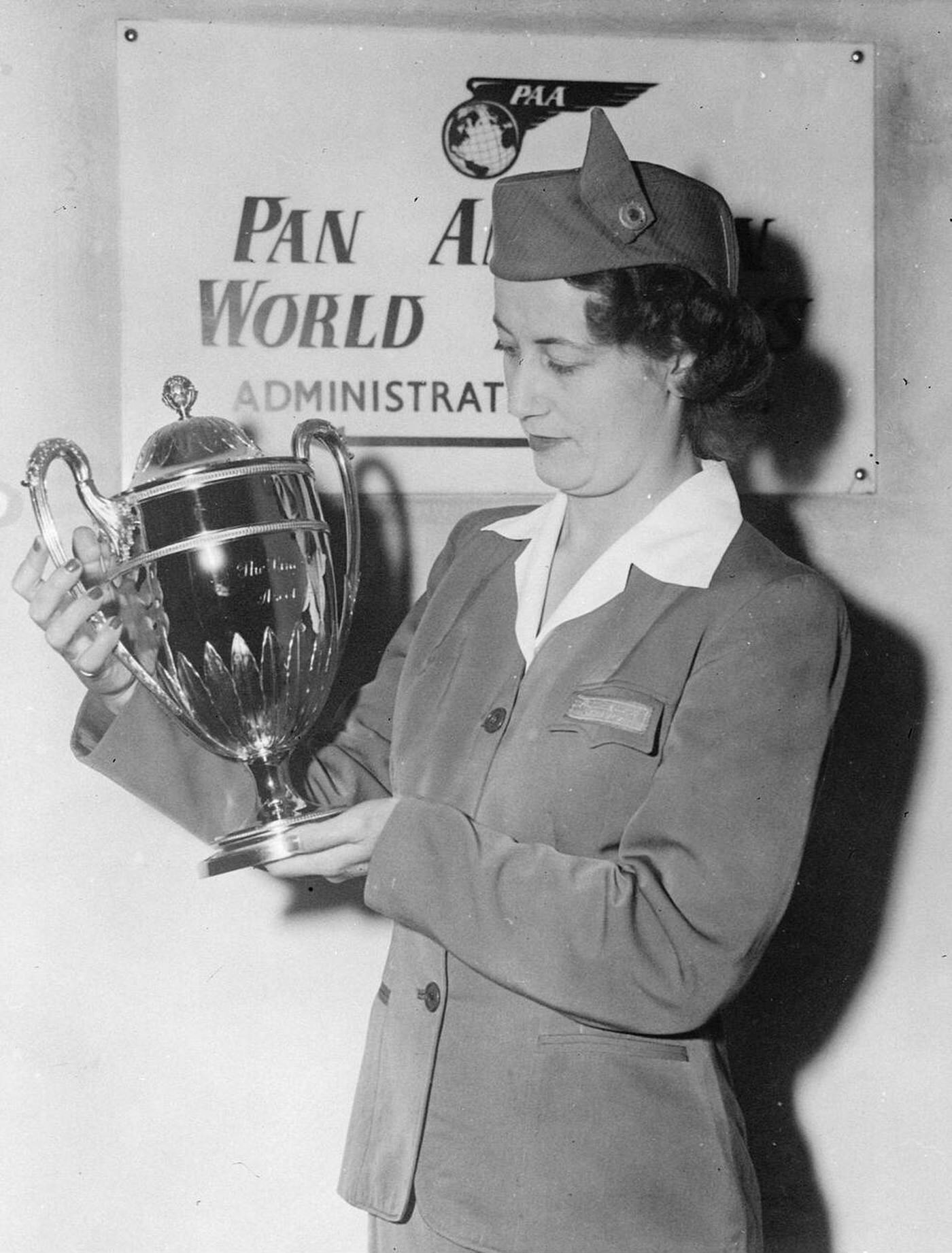 Pan American Airways Stewardess Joan Clapham Delivering The Gold Vase Won At Ascot By Nona Eagle To Mr. William Woodward Of New York, 1949.