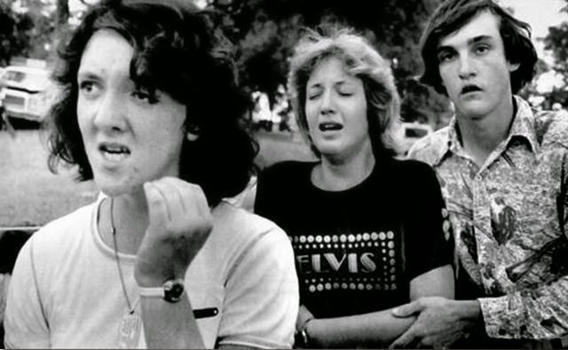 Grieving Fans Leave Graceland Mansion After Viewing Elvis Presley Body In Memphis.