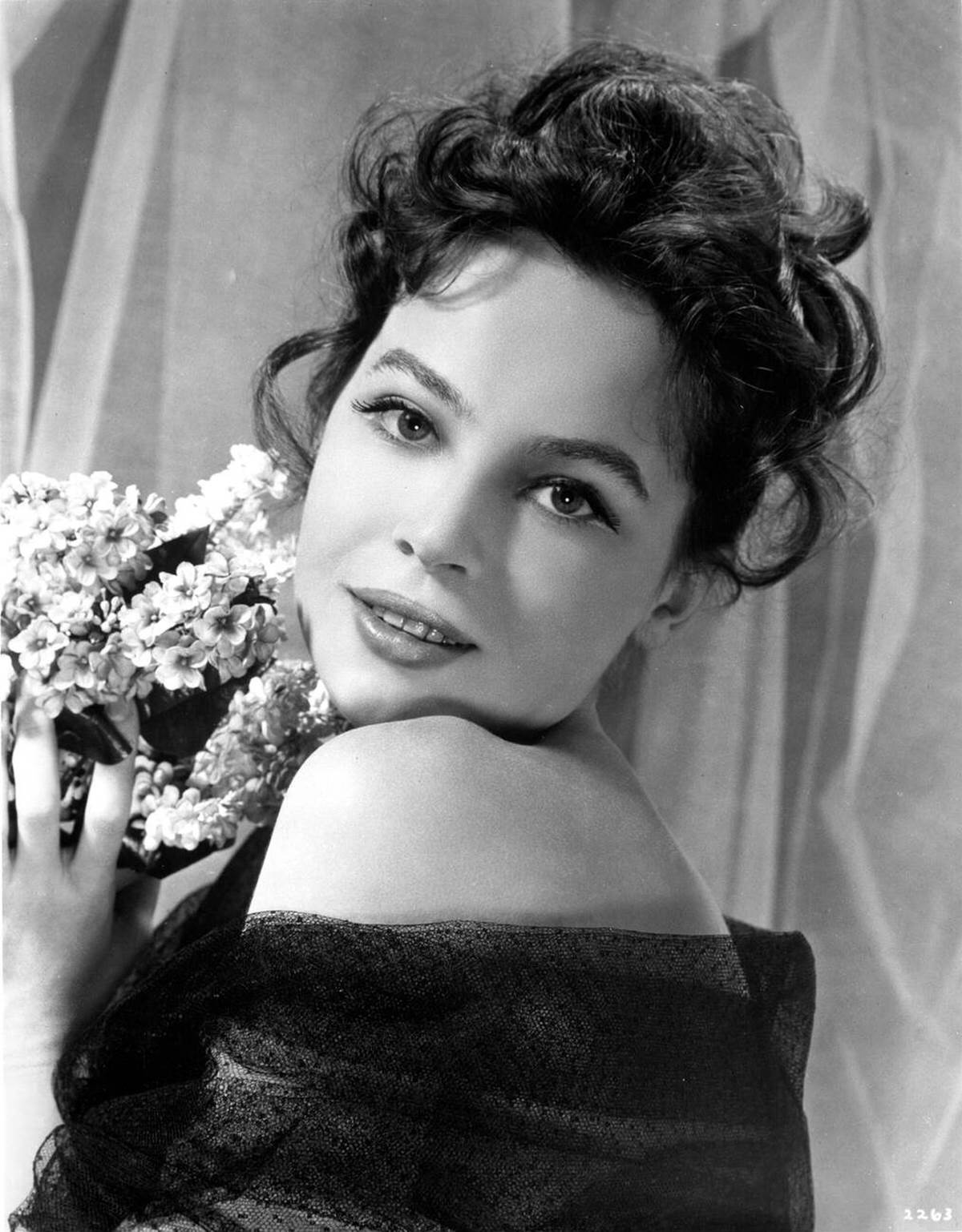 Leslie Caron With A Bouquet Of Flowers, 1956.