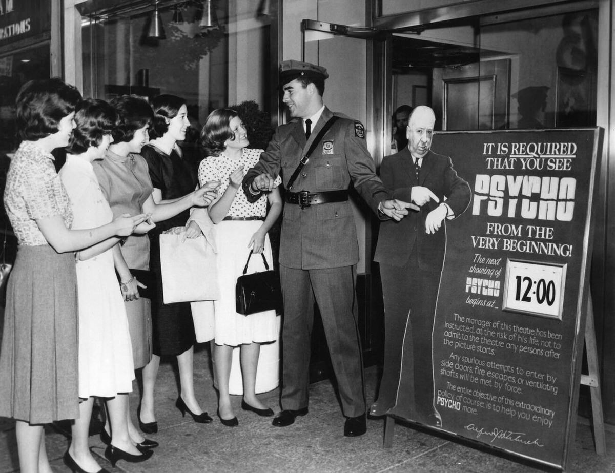 A Pinkerton Security Guard Outside The Baronet Movie Theatre In New York City Refusing Late Admission To Women Wanting To See Psycho, 1960.