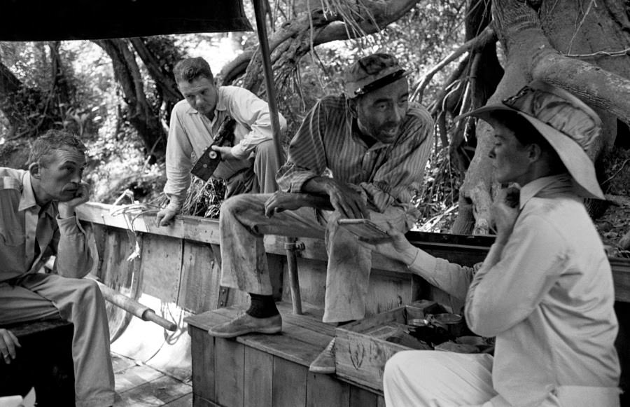 Humphrey Bogart And Katharine Hepburn Rehearse A Scene While Crew Members Watch, On Location For The African Queen.