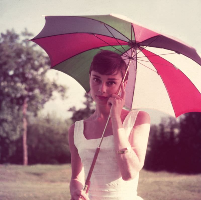Audrey Hepburn Wearing A Sundress And Holding An Umbrella, 1955