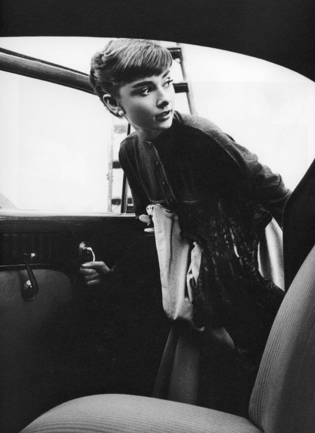 Audrey Hepburn Entering A Paramount Studios Car, 1953
