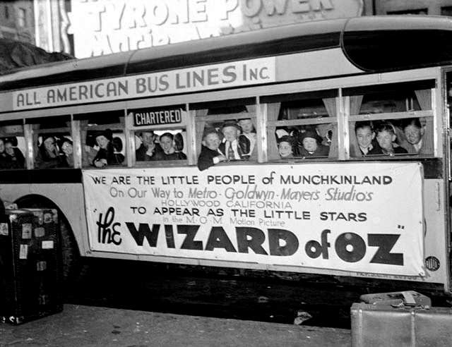The Actors Who Portrayed The Munchkins Aboard A Bus Headed To The Studio For Filming.
