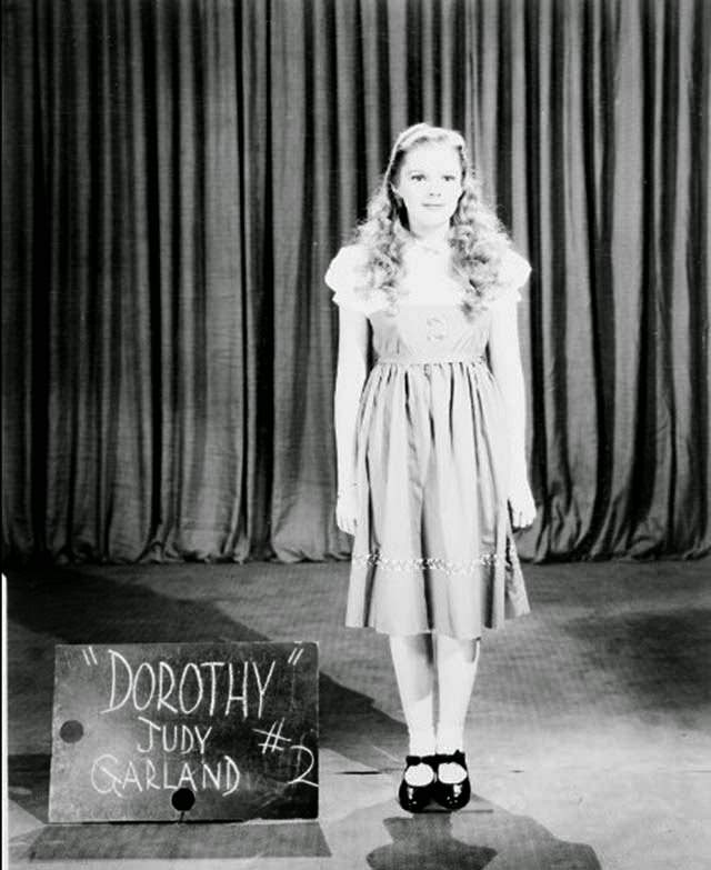 A Wardrobe Test Shot Of Judy Garland In A Rejected Dorothy Costume With A Blonde Wig.