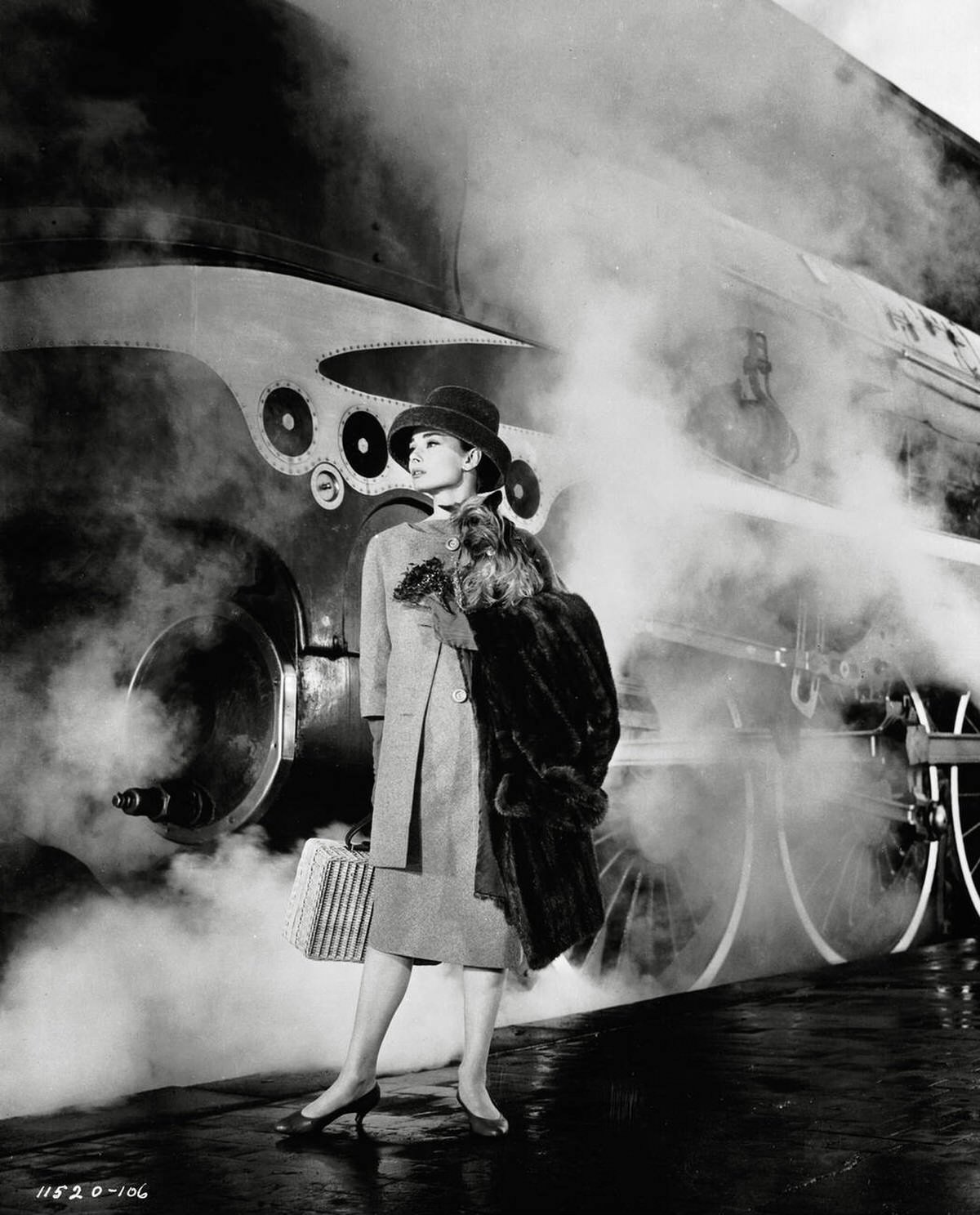 Audrey Hepburn Emerging Through Train Smoke In A Scene From The Film, Funny Face, 1956