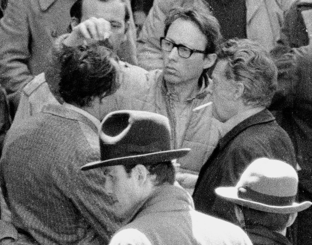 A Producer Adjusts Brando'S Hair.