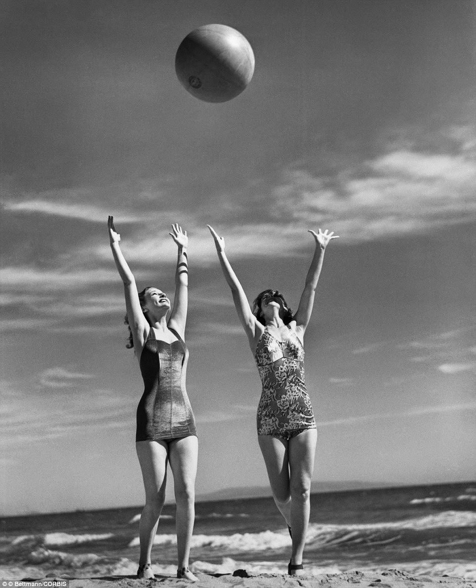 Mary Howard And Ann Morris Show Off Some Early 1940S-Style Swimwear As They Frolic With A Ball In The Summer Of 1941.
