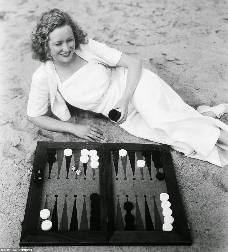 Miriam Hopkins Enjoys A Game Of Backgammon On The Beach After Finishing Filming The Smiling Lieutenant In 1931.