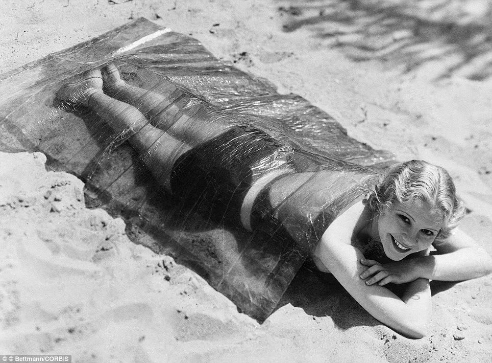 June Clyde Shows Off The Fad Of Covering Yourself In Cellophane To Prevent Sunburn In 1932.