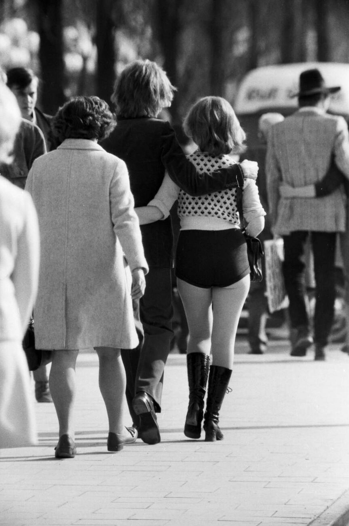 Young Woman Wearing Hotpant And Knee-High Boots Walking In Munich-Schwabing, 1971