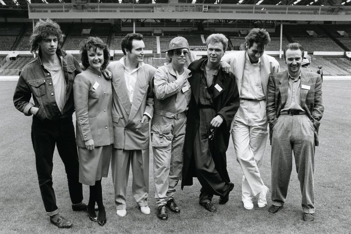 Bob Geldof, Janice Long, Adam Ant, Elton John, Gary Kemp, Tony Hadley, And Midge Ure At Wembley, 1985