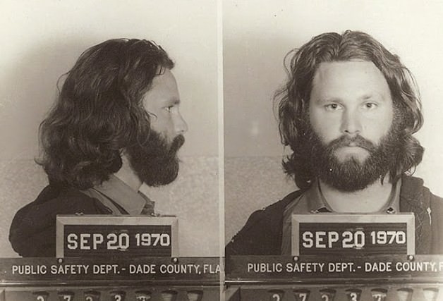 Jim Morrison Posed For This Mug Shot Following His 1970 Conviction In Florida On Misdemeanor Indecent Exposure And Profanity Charges. The Singer Was Busted After He Exposed Himself During A March 1969 Concert In Miami. As Seen Here, Morrison, Who Was Photographed By Dade County'S Public Safety Department, Testified On His Own Behalf At Trial.