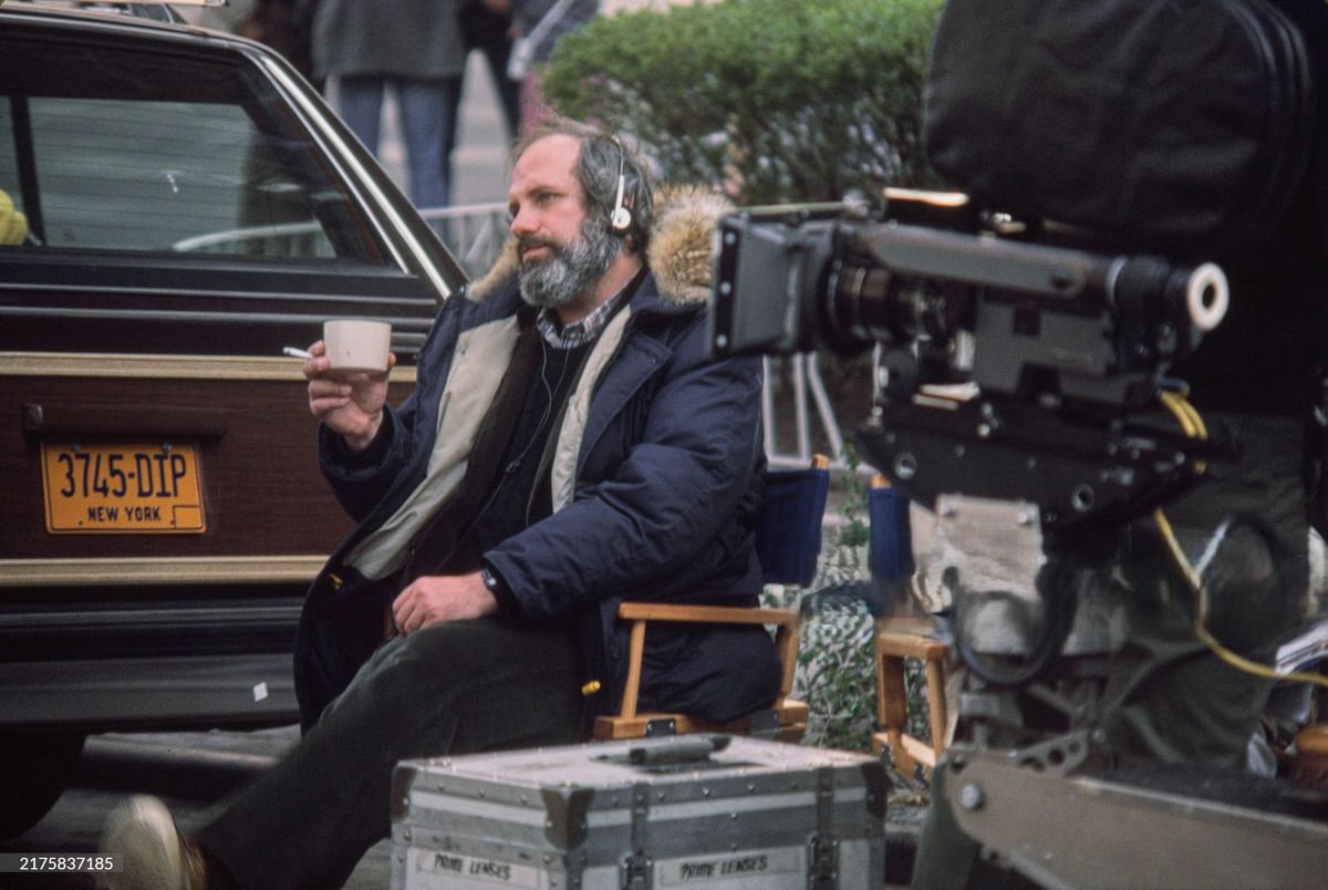 Brian De Palma Wearing Headphones During A Break From Filming On The Set Of 'Scarface', 1983