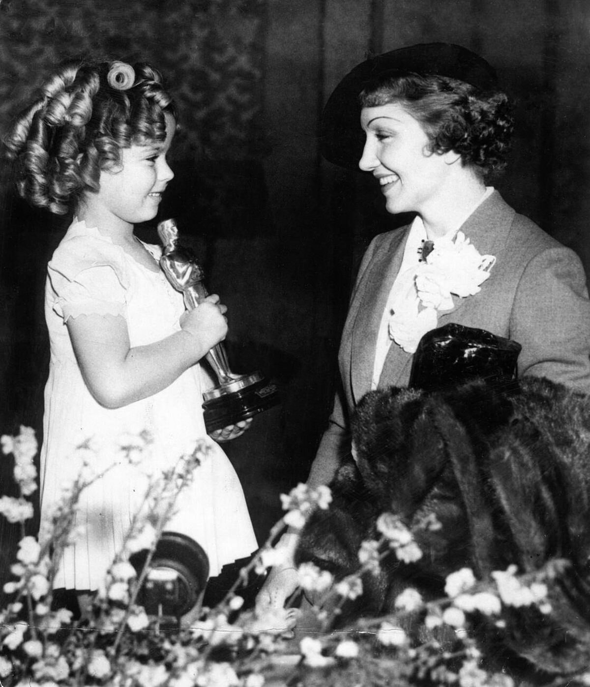 Shirley Temple Presenting The Best Actress Oscar To Claudette Colbert, 1935