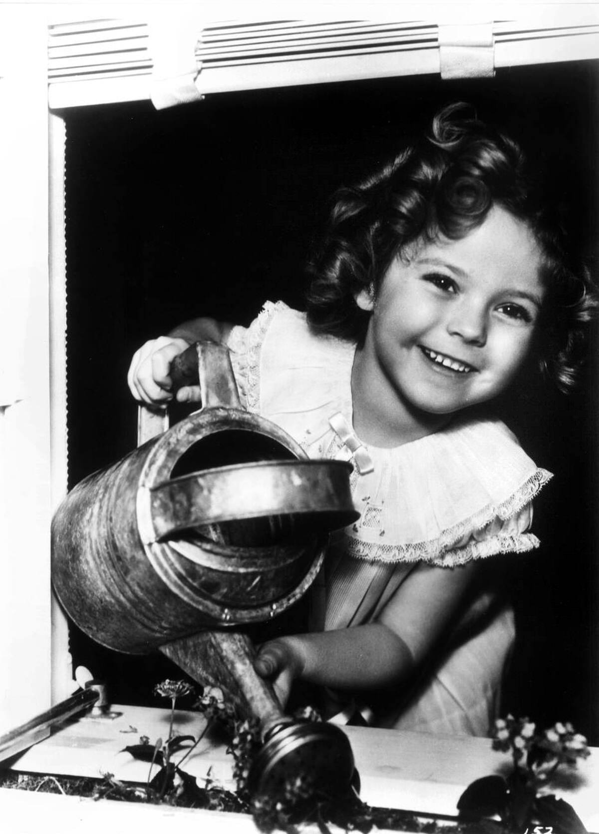 Shirley Temple With A Watering Can, 1936