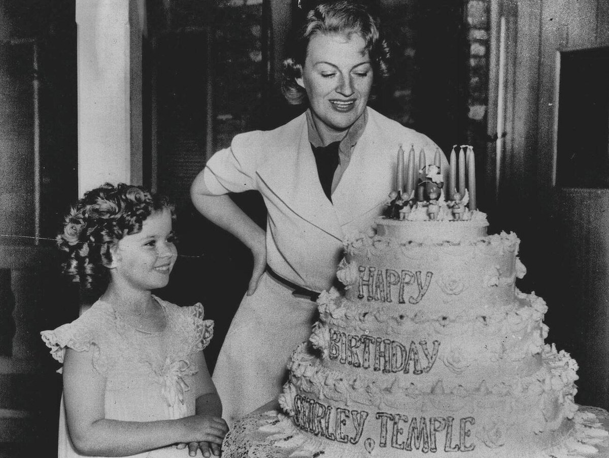 Gracie Fields Helping Shirley Temple Cut Her Birthday Cake, 1937