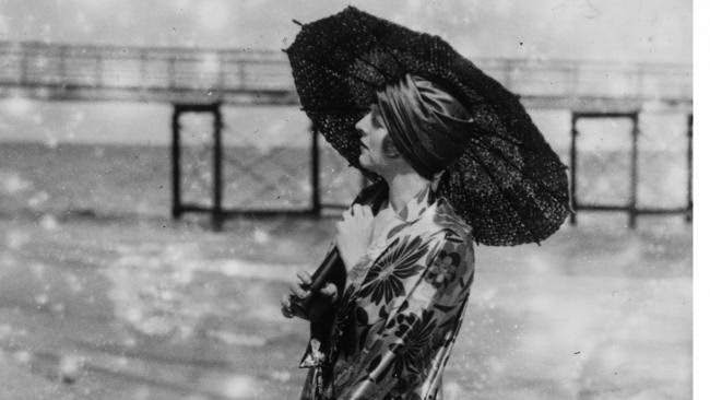 Beach Fashion Featuring A Parasol In England, 1927