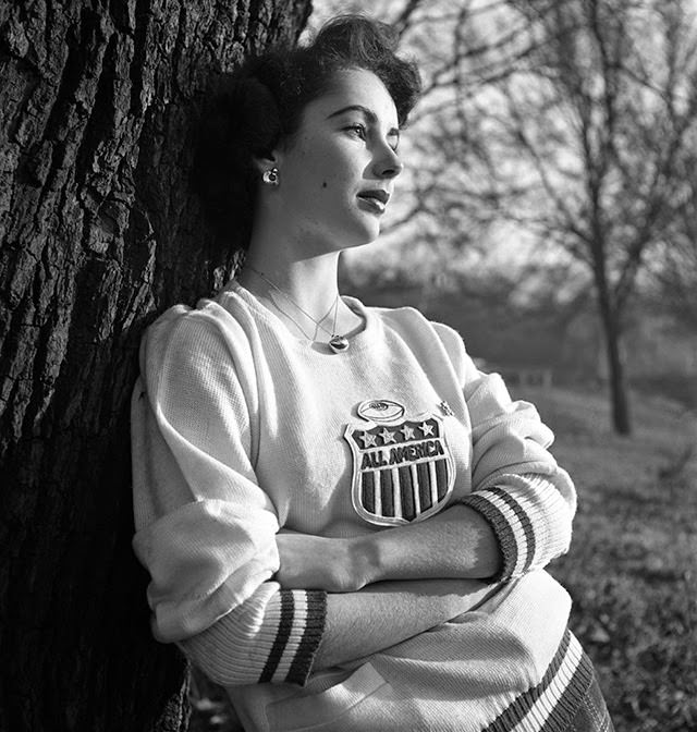 Liz Taylor Gazes Into The Distance While Wearing An &Amp;Quot;All America&Amp;Quot; Sweatshirt, 1948.