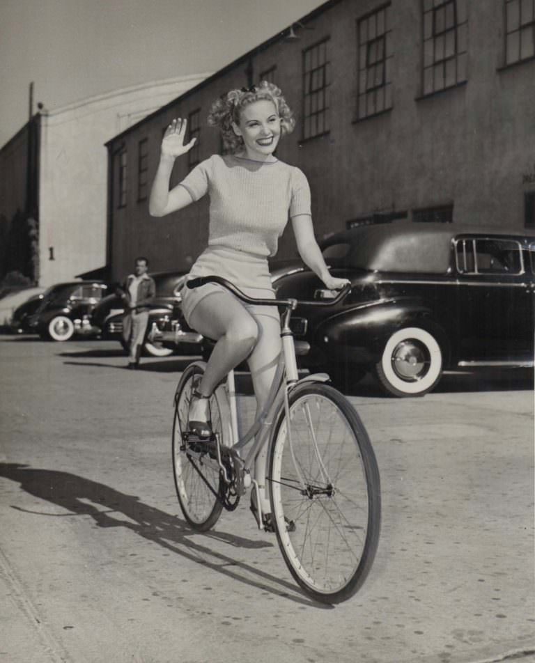 Pat Clark Riding A Bicycle On The Warner Bros. Backlot, 1945.