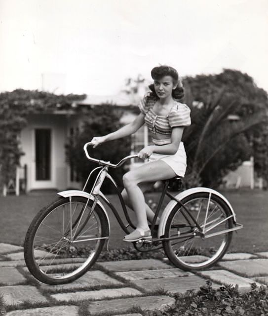 Ida Lupino Riding A Bicycle In Her Neighborhood, 1941.