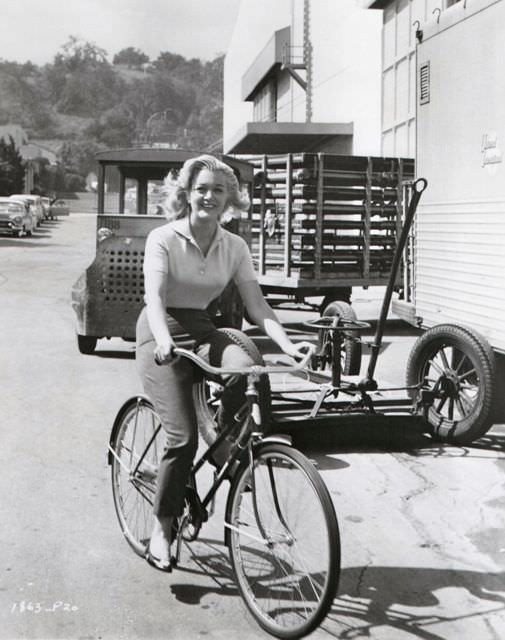 Jan Sterling Riding A Bicycle On The Universal Backlot, 1958.