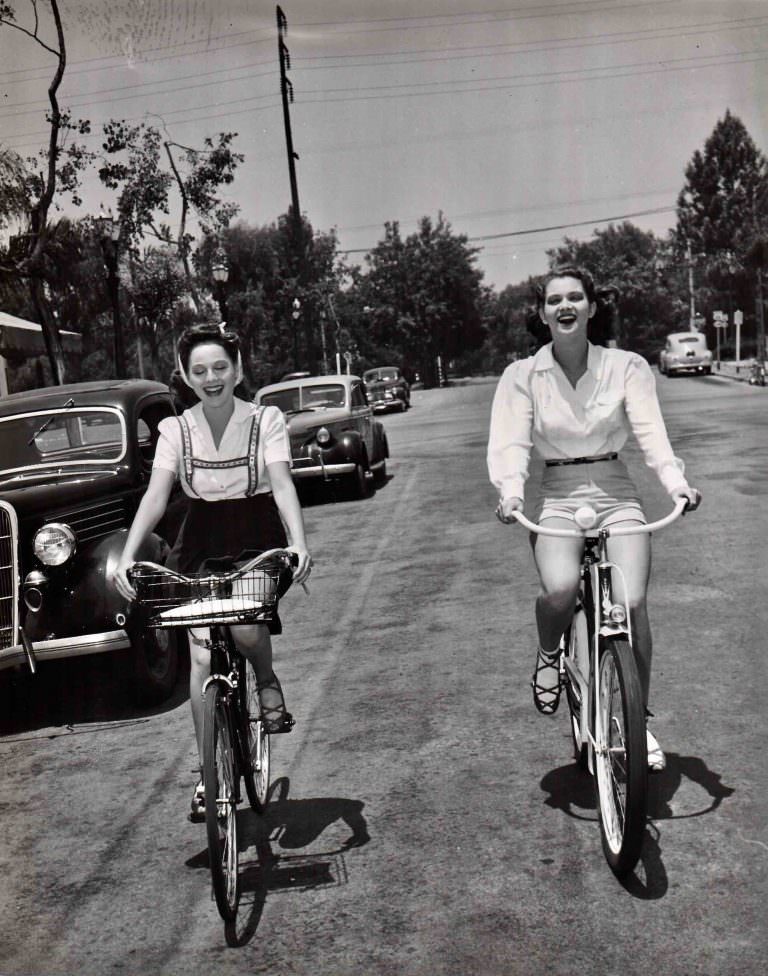 Dorothy Morris And Frances Rafferty Riding Bicycles, 1941.