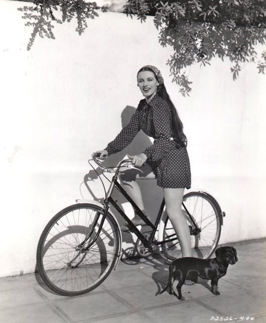 Patricia Morison Rides A Bike.