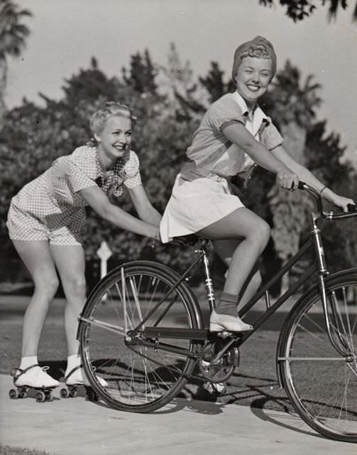 Phyllis Ruth Rides A Bike, Carole Landis Skitches On Skates.